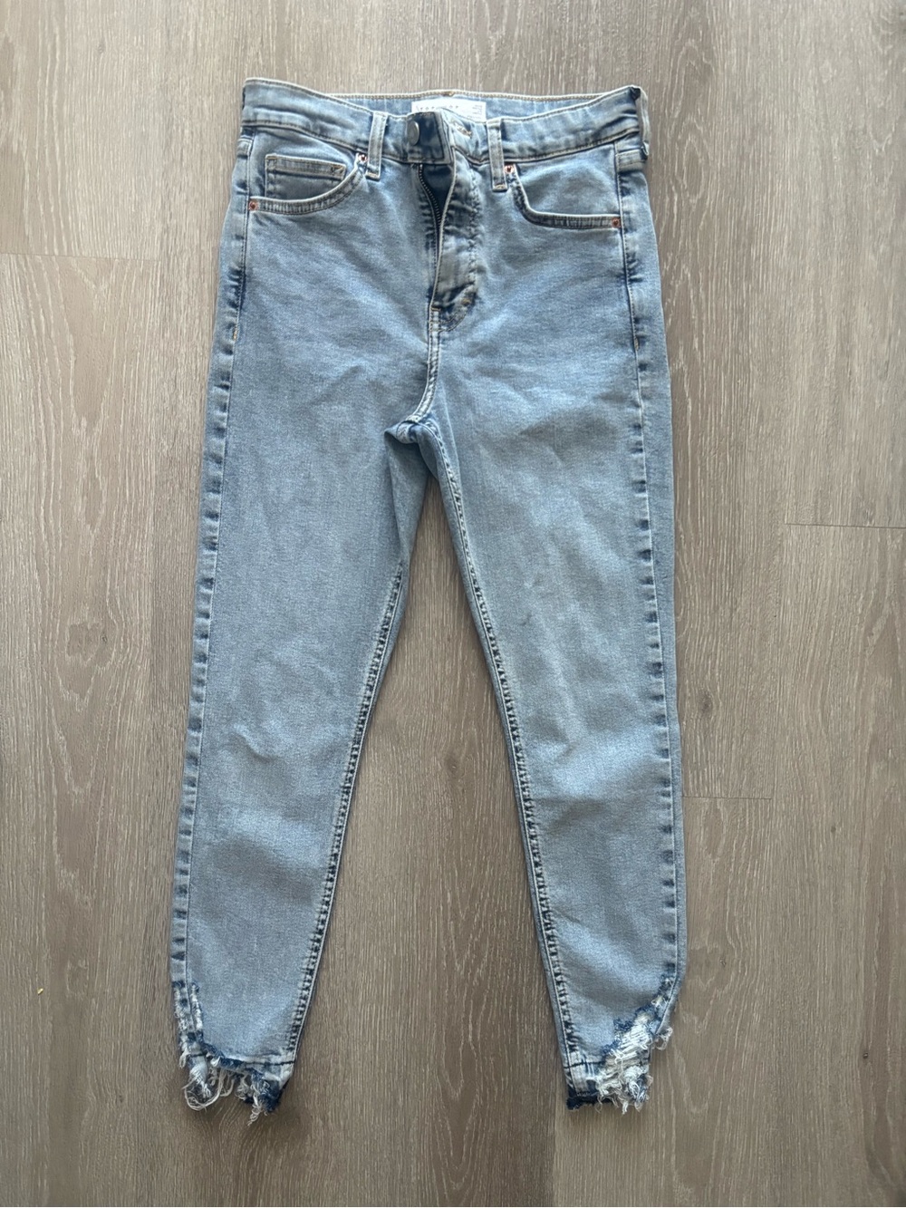 Topshop Petite high rise Jamie jeans with bottom fringe rips in light blue wash